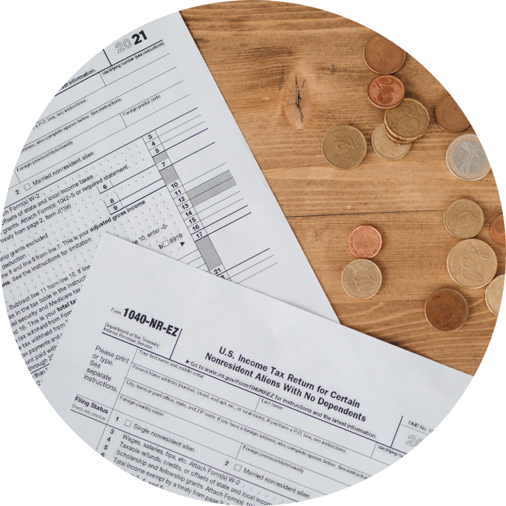 tax files with coins beside