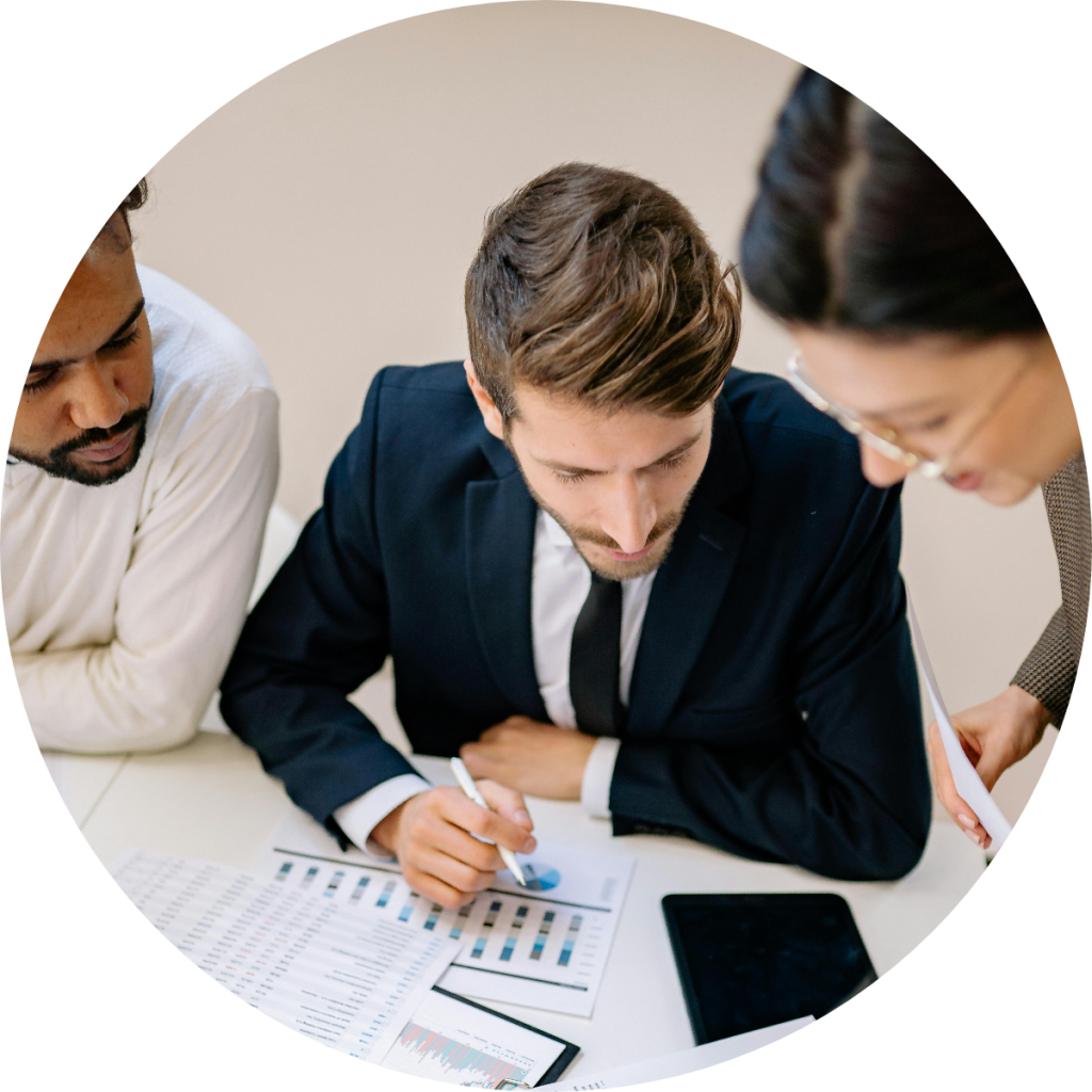Diverse business team reviewing financial charts and data reports together during investment planning or accounting strategy meeting